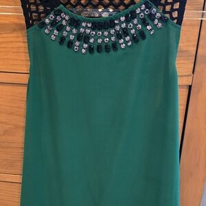 Green Sleeveless Top with Black Embellishments